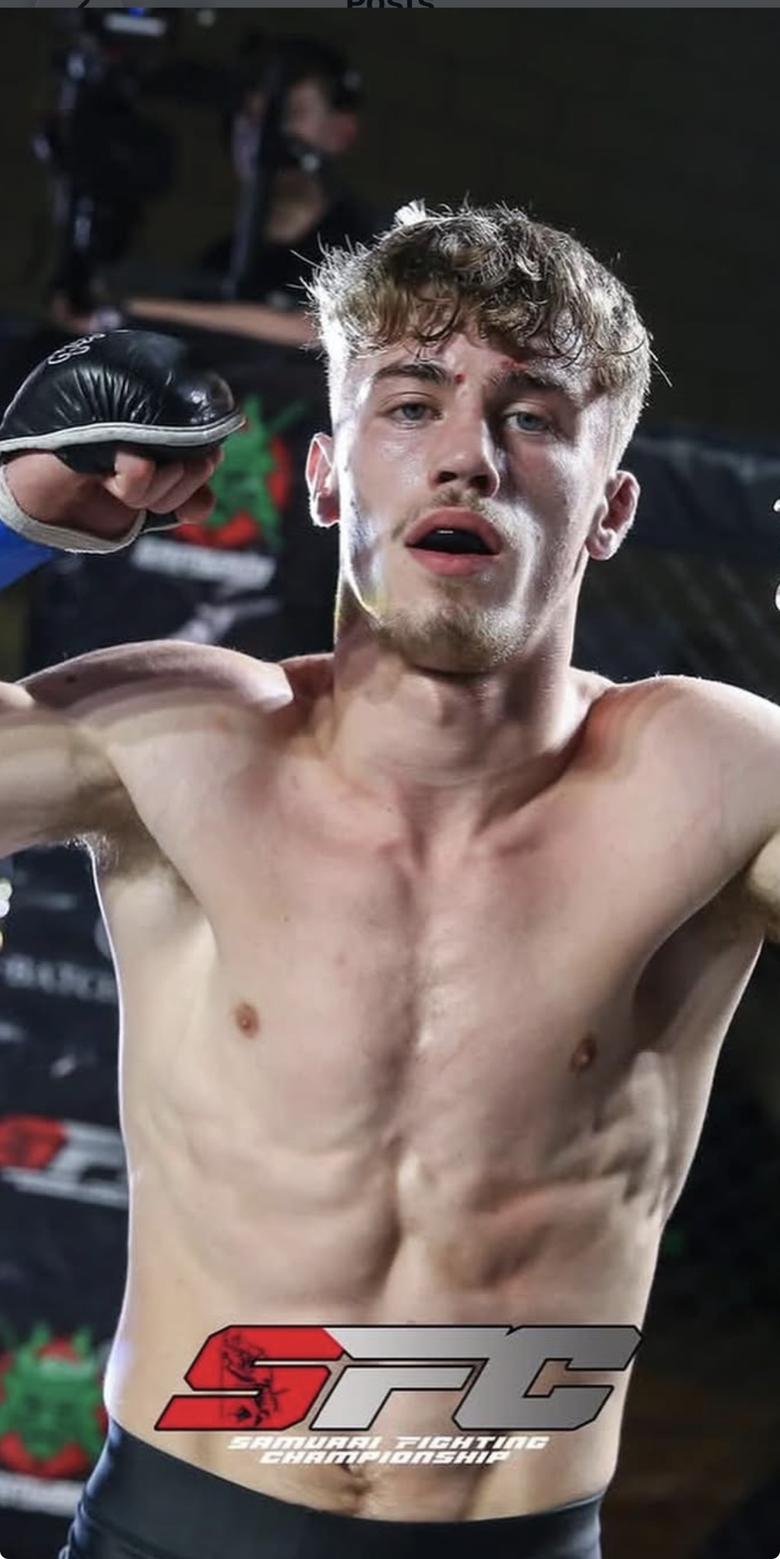 Dylan Hall celebrating in the cage at Samurai Fighting Championship