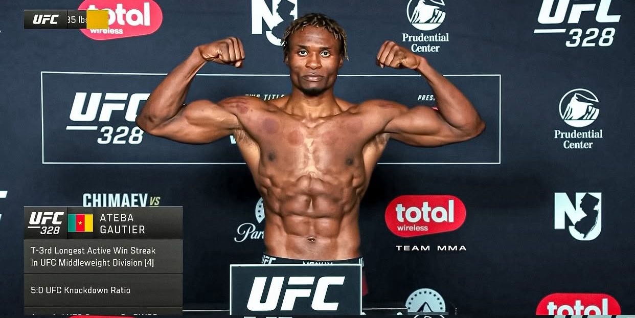 Ateba Gautier flexing at the UFC 328 weigh-ins